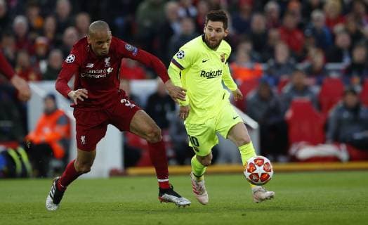Football - 2018 2019 UEFA Champions League - Semi-Final, Second Leg: Liverpool (0) vs. Barcelona (3) Fabinho of Liverpool and Lionel Messi of Barcelona at Anfield. COLORSPORT LYNNE CAMERON 