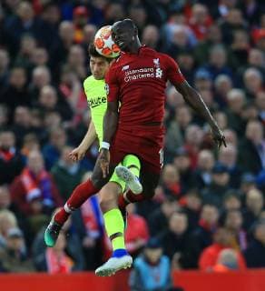 7th May 2019, Anfield, Liverpool, England; UEFA Champions League football, semi final second leg, Liverpool versus FC Barcelona Barca Clement Lenglet of Barcelona and Sadio Mane of Liverpool clash as they compete for the ball in the air  ActionPlus12132166 DavidxBlunsden