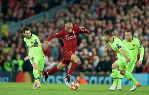 (190508) -- LIVERPOOL, May 8, 2019 (Xinhua) -- Liverpool s Fabinho (C) is fouled by FC Barcelona Barca s Lionel Messi (L) during the UEFA Champions League Semi-Final second Leg match between Liverpool FC and FC Barcelona at Anfield in Liverpool, Britain on May 7, 2019. Liverpool won 4-3 on aggregate and reached the final. (Xinhua) FOR EDITORIAL USE ONLY. NOT FOR SALE FOR MARKETING OR ADVERTISING CAMPAIGNS. NO USE WITH UNAUTHORIZED AUDIO, VIDEO, DATA, FIXTURE LISTS, CLUB LEAGUE LOGOS OR LIVE SERVICES. ONLINE IN-MATCH USE LIMITED TO 45 IMAGES, NO VIDEO EMULATION. NO USE IN BETTING, GAMES OR SINGLE CLUB LEAGUE PLAYER PUBLICATIONS. (SP)BRITAIN-LIVERPOOL-FOOTBALL-UEFA CHAMPIONS LEAGUE-LIVERPOOL VS FC BARCELONA