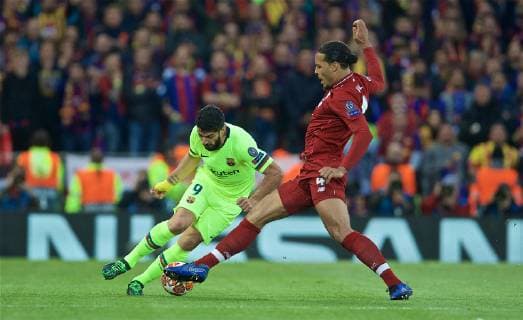 (190508) -- LIVERPOOL, May 8, 2019 (Xinhua) -- Liverpool s Virgil van Dijk (R) tackles FC Barcelona Barca s Luis Suarez during the UEFA Champions League Semi-Final second Leg match between Liverpool FC and FC Barcelona at Anfield in Liverpool, Britain on May 7, 2019. Liverpool won 4-3 on aggregate and reached the final. (Xinhua) FOR EDITORIAL USE ONLY. NOT FOR SALE FOR MARKETING OR ADVERTISING CAMPAIGNS. NO USE WITH UNAUTHORIZED AUDIO, VIDEO, DATA, FIXTURE LISTS, CLUB LEAGUE LOGOS OR LIVE SERVICES. ONLINE IN-MATCH USE LIMITED TO 45 IMAGES, NO VIDEO EMULATION. NO USE IN BETTING, GAMES OR SINGLE CLUB LEAGUE PLAYER PUBLICATIONS. (SP)BRITAIN-LIVERPOOL-FOOTBALL-UEFA CHAMPIONS LEAGUE-LIVERPOOL VS FC BARCELONA