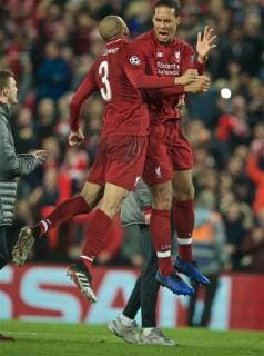 (190508) -- LIVERPOOL, May 8, 2019 (Xinhua) -- Liverpool s Virgil van Dijk (R) celebrates with teammate Fabinho after the UEFA Champions League Semi-Final second Leg match between Liverpool FC and FC Barcelona Barca at Anfield in Liverpool, Britain on May 7, 2019. Liverpool won 4-3 on aggregate and reached the final. (Xinhua) FOR EDITORIAL USE ONLY. NOT FOR SALE FOR MARKETING OR ADVERTISING CAMPAIGNS. NO USE WITH UNAUTHORIZED AUDIO, VIDEO, DATA, FIXTURE LISTS, CLUB LEAGUE LOGOS OR LIVE SERVICES. ONLINE IN-MATCH USE LIMITED TO 45 IMAGES, NO VIDEO EMULATION. NO USE IN BETTING, GAMES OR SINGLE CLUB LEAGUE PLAYER PUBLICATIONS. (SP)BRITAIN-LIVERPOOL-FOOTBALL-UEFA CHAMPIONS LEAGUE-LIVERPOOL VS FC BARCELONA