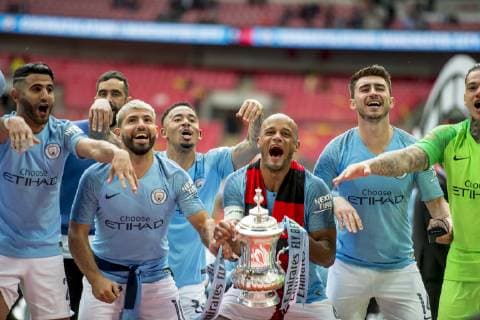 Vincent Kompany of Manchester City and his team mates lift the FA Trophy during The FA Cup Final match between Manchester City and Watford at Wembley Stadium, London, England on 18 May 2019. Copyright: xSalvioxCalabresex 24040054