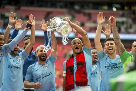 Vincent Kompany of Manchester City and his team mates lift the FA Trophy during The FA Cup Final match between Manchester City and Watford at Wembley Stadium, London, England on 18 May 2019. Copyright: xSalvioxCalabresex 24040058