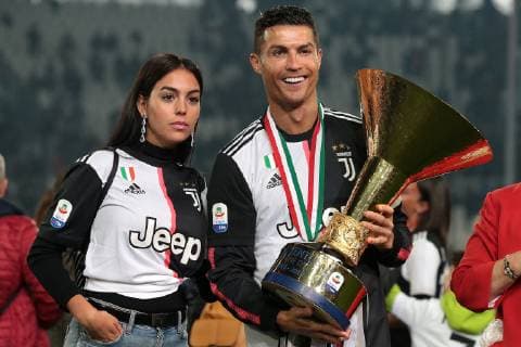 Georgina Rodriguez, Cristiano Ronaldo of Juventus and his mother Maria Dolores dos Santos Aveiro pictured with the trophy following the Serie A match at Allianz Stadium, Turin. Picture date: 19th May 2019. Picture credit should read: Jonathan Moscrop Sportimage EDITORIAL USE ONLY. No use with unauthorised audio, video, data, fixture lists, club league logos or live services. Online in-match use limited to 120 images, no video emulation. No use in betting, games or single club league player publications. SPI-0086-0064