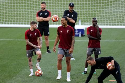 31st May 2019; Wanda Metropolitano stadium, Madrid, Spain; UEFA Champions league final training for Liverpool FC; Virgil van Dijk of Liverpool juggles with the ball as Liverpool Manager Jurgen Klopp smiles behind him  ActionPlus12139813 ShaunxBrooks