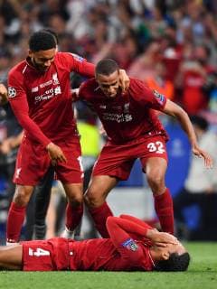 190601 Joe Gomez, Joel Matip and Virgil van Dijk of Liverpool celebrate after winning the UEFA Champions League final between Tottenham and Liverpool on June 1, 2019 in Madrid. Photo: Petter Arvidson BILDBYRAN kod PA 92302 Copyright: PETTERxARVIDSON BB190601PA159