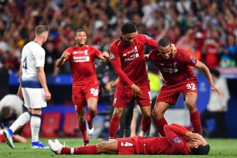 190601 Joe Gomez, Joel Matip and Virgil van Dijk of Liverpool celebrate after winning the UEFA Champions League final between Tottenham and Liverpool on June 1, 2019 in Madrid. Photo: Petter Arvidson BILDBYRAN kod PA 92302 Copyright: PETTERxARVIDSON BB190601PA161