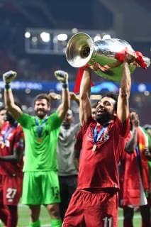 190601 Mohamed Salah of Liverpool celebrates with the throphy after the UEFA Champions League final between Tottenham and Liverpool on June 1, 2019 in Madrid. Photo: Petter Arvidson BILDBYRAN kod PA 92302 Copyright: PETTERxARVIDSON BB190601PA180
