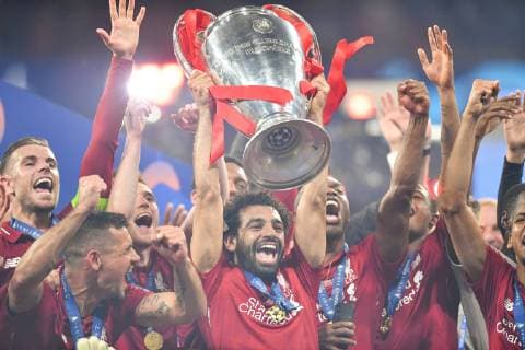 190601 Mohamed Salah of Liverpool raises the throphy in front of team mates at the medal ceremony after the UEFA Champions League final between Tottenham and Liverpool on June 1, 2019 in Madrid. Photo: Petter Arvidson BILDBYRAN kod PA 92302 Copyright: PETTERxARVIDSON BB190601PA188