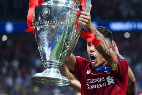 190601 Roberto Firmino of Liverpool celebrates with the trophy after the UEFA Champions League final between Tottenham and Liverpool on June 1, 2019 in Madrid. Photo: Petter Arvidson BILDBYRAN kod PA 92302 Copyright: PETTERxARVIDSON BB190601PA236