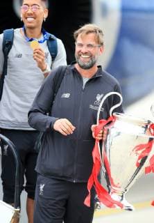 FuÃŸball, Champions League Sieger FC Liverpool - Ankunft auf dem John Lennon Airport 2nd June 2019, Liverpool John Lennon Airport, Liverpool, Merseyside; Liverpool FC return to Liverpool after their Champions League final win over Tottenham Hotspur on 1st June in Madrid; Liverpool manager Jurgen Klopp with the trophy as he steps off the aircraft  ActionPlus12140568 DavidxBlunsden