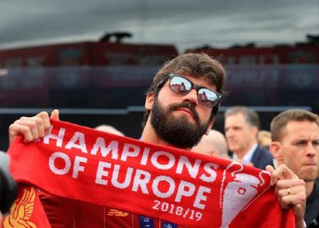 FuÃŸball, Champions League Sieger FC Liverpool feiert den Triumph mit den Fans 2nd June 2019, Liverpool, Merseyside; Liverpool FC celebration parade after their Champions League final win over Tottenham Hotspur in Madrid on 1st June; Liverpool goalkeeper Alisson Becker poses for a photo with a Champions of Europe scarf  ActionPlus12140709 DavidxBlunsden