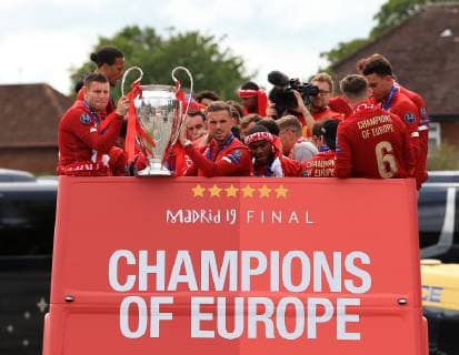 FuÃŸball, Champions League Sieger FC Liverpool feiert den Triumph mit den Fans 2nd June 2019, Liverpool, Merseyside; Liverpool FC celebration parade after their Champions League final win over Tottenham Hotspur in Madrid on 1st June; James Milner of Liverpool and Jordan Henderson of Liverpool hold the trophy at the front of the team s bus  ActionPlus12140713 DavidxBlunsden