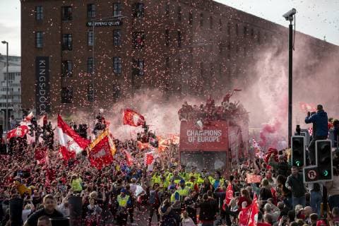 (190603) -- LIVERPOOL, June 3, 2019 () -- Liverpool s players are cheered by their supporters during an open-topped bus parade through the city after winning the UEFA Champions League Final in Liverpool, Britain on June 2, 2019. Liverpool beat Tottenham Hotspur 2-0 in Madrid to claim their sixth champion of the event on June 1. () (SP) BRITAIN-LIVERPOOL-FOOTBALL-UEFA CHAMPIONS LEAGUE-LIVERPOOL TROPHY PARADE Xinhua 