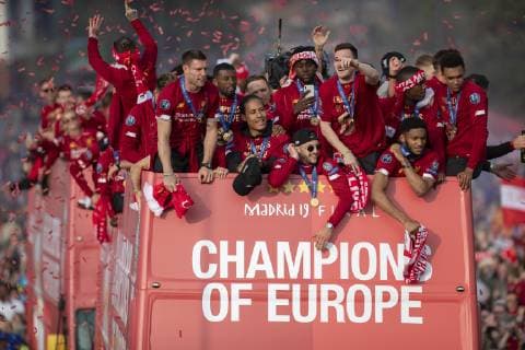 (190603) -- LIVERPOOL, June 3, 2019 () -- Liverpool s players are cheered by their supporters during an open-topped bus parade through the city after winning the UEFA Champions League Final in Liverpool, Britain on June 2, 2019. Liverpool beat Tottenham Hotspur 2-0 in Madrid to claim their sixth champion of the event on June 1. () (SP) BRITAIN-LIVERPOOL-FOOTBALL-UEFA CHAMPIONS LEAGUE-LIVERPOOL TROPHY PARADE Xinhua 
