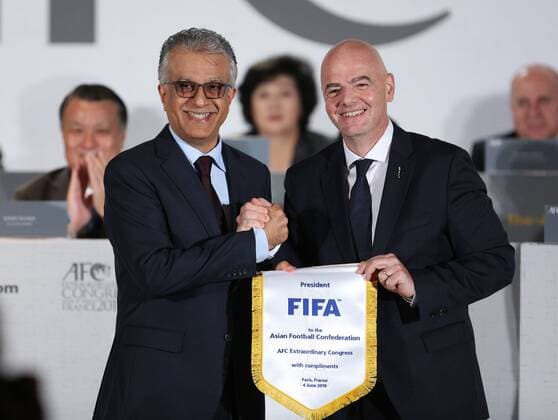 (190604) -- PARIS, June 4, 2019 (Xinhua) -- AFC President Shaikh Salman bin Ebrahim Al Khalifa (L) and FIFA President Gianni Infantino pose for photos during the AFC Extraordinary Congress in Paris, France, June 4, 2019. China was confirmed as the host of the AFC Asian Cup 2023. (SP)FRANCE-PARIS-AFC-ASIAN CUP-2023 