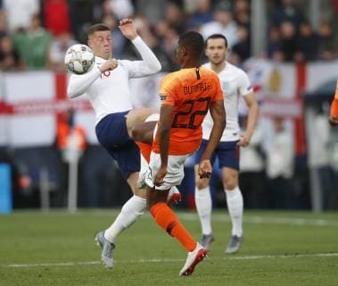 Ross Barkley of England tackles Denzel Dumfries of Netherlands during the UEFA Nations League match at D. Afonso Henriques Stadium, Guimaraes. Picture date: 6th June 2019. Picture credit should read: David Klein Sportimage EDITORIAL USE ONLY. No use with unauthorised audio, video, data, fixture lists, club league logos or live services. Online in-match use limited to 120 images, no video emulation. No use in betting, games or single club league player publications. SPI-0093-0032