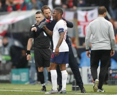 Gareth Southgate manager of England coaches Raheem Sterling of England during the UEFA Nations League match at D. Afonso Henriques Stadium, Guimaraes. Picture date: 6th June 2019. Picture credit should read: David Klein Sportimage EDITORIAL USE ONLY. No use with unauthorised audio, video, data, fixture lists, club league logos or live services. Online in-match use limited to 120 images, no video emulation. No use in betting, games or single club league player publications. SPI-0093-0056