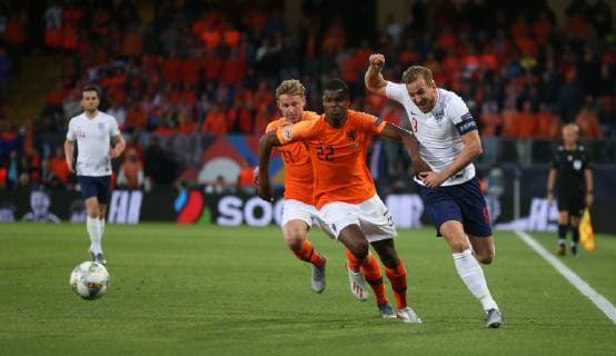 Netherlands v England UEFA Nations League Semi-Final Denzel Dumfries of Netherlands and Harry Kane of England battle for the ball during the UEFA Nations League Semi-Final match at Estadio D. Afonso Henrique, Guimaraes Content Not Available For UK Newspapers Copyright: xPaulxChestertonx FIL-13327-0067