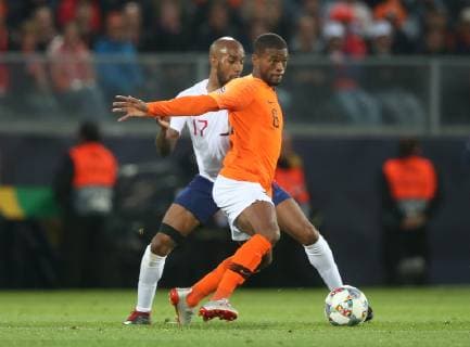 Netherlands v England UEFA Nations League Semi-Final Georginio Wijnaldum of Netherlands and Fabian Delph of England during the UEFA Nations League Semi-Final match at Estadio D. Afonso Henrique, Guimaraes Content Not Available For UK Newspapers Copyright: xPaulxChestertonx FIL-13327-0089
