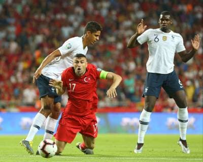 Fußball, EM Quali, Türkei - Frankreich Burak Yilmaz of Turkey and Rafael Varane (L) , Paul Pogba (R) of France during the Euro 2020 football qualification match between Turkey and France at the Buyuksehir Belediyesi stadium in Konya, on June 8, 2019. 