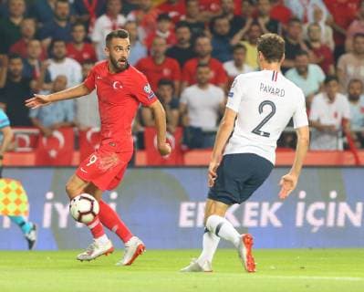 Kenan Karaman (L) of Turkey and Benjamin Pavard (R) of France during the Euro 2020 football qualification match between Turkey and France at the Buyuksehir Belediyesi stadium in Konya, on June 8, 2019. 