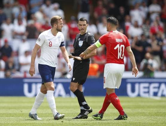 Referee Ovidiu Hategan tells Harry Kane of England and Granit Xhaka of Switzerland to cool things down during the UEFA Nations League match at D. Afonso Henriques Stadium, Guimaraes. Picture date: 9th June 2019. Picture credit should read: David Klein Sportimage EDITORIAL USE ONLY. No use with unauthorised audio, video, data, fixture lists, club league logos or live services. Online in-match use limited to 120 images, no video emulation. No use in betting, games or single club league player publications. SPI-0095-0024