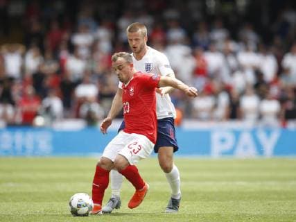 Xherdan Shaqiri of Switzerland tackled by Eric Dier of England during the UEFA Nations League match at D. Afonso Henriques Stadium, Guimaraes. Picture date: 9th June 2019. Picture credit should read: David Klein Sportimage EDITORIAL USE ONLY. No use with unauthorised audio, video, data, fixture lists, club league logos or live services. Online in-match use limited to 120 images, no video emulation. No use in betting, games or single club league player publications. SPI-0095-0031