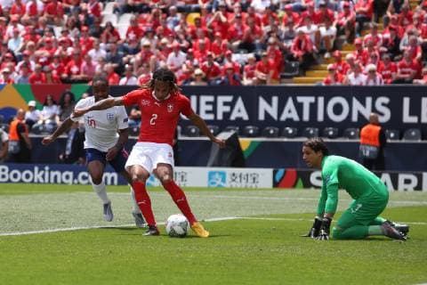Switzerland v England UEFA Nations League 3rd Place Play-off Kevin Mbabu of Switzerland clears the ball ahead of Raheem Sterling of England during the UEFA Nations League 3rd Place Play-off match at Estadio D. Afonso Henrique, Guimaraes Content Not Available For UK Newspapers Copyright: xPaulxChestertonx FIL-13338-0015