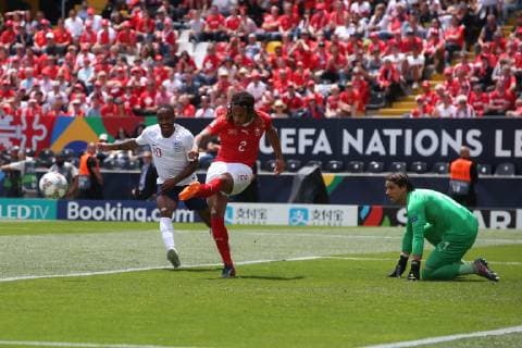 Switzerland v England UEFA Nations League 3rd Place Play-off Kevin Mbabu of Switzerland clears the ball ahead of Raheem Sterling of England during the UEFA Nations League 3rd Place Play-off match at Estadio D. Afonso Henrique, Guimaraes Content Not Available For UK Newspapers Copyright: xPaulxChestertonx FIL-13338-0016