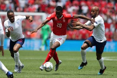 June 9, 2019 - Guimaraes, Portugal - Switzerland s midfielder Edi Fernandes (C ) vies with Raheem Sterling of England (L) and Fabian Delph of England (R ) during the UEFA Nations League Third-place football match between Switzerland and England, at the Dom Afonso Henriques stadium in Guimaraes, Portugal, on June 9, 2019. Switzerland vs England - UEFA Nations League Third-place match  - ZUMAn230 20190609_zaa_n230_064 Copyright: xPedroxFiuzax