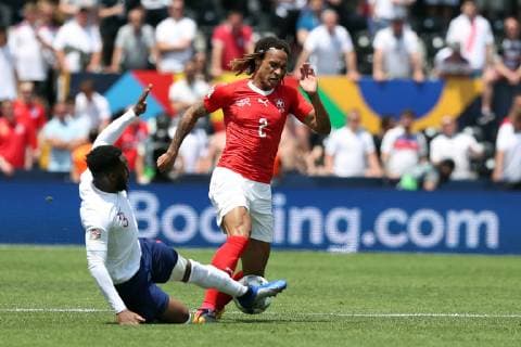 June 9, 2019 - Guimaraes, Portugal - Danny Rose of England (L) vies with Switzerland s defender Kevin Mbabu (R ) during the UEFA Nations League Third-place football match between Switzerland and England, at the Dom Afonso Henriques stadium in Guimaraes, Portugal, on June 9, 2019. Switzerland vs England - UEFA Nations League Third-place match  - ZUMAn230 20190609_zaa_n230_065 Copyright: xPedroxFiuzax