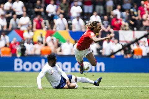 9th June 2019, St& xe1;dio D Afonso Henriques, Porto, Portugal; UEFA Nations League Football 3rd placed final, England versus Switzerland; Danny Rose of ENG tackles Mbabu of SUI for which he receives a yellow card  ActionPlus12142574 NikolaxKrstic