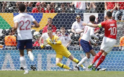 Jordan Pickford of England moves to save from Granit Xhaka of Switzerland during the UEFA Nations League match at D. Afonso Henriques Stadium, Guimaraes. Picture date: 9th June 2019. Picture credit should read: David Klein Sportimage EDITORIAL USE ONLY. No use with unauthorised audio, video, data, fixture lists, club league logos or live services. Online in-match use limited to 120 images, no video emulation. No use in betting, games or single club league player publications. SPI-0095-0047