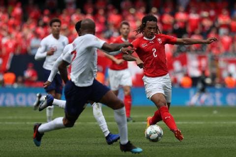June 9, 2019 - Guimaraes, Portugal - Switzerland s defender Kevin Mbabu (R ) vies with Jesse Lingard of England (L) during the UEFA Nations League Third-place football match between Switzerland and England, at the Dom Afonso Henriques stadium in Guimaraes, Portugal, on June 9, 2019. Switzerland vs England - UEFA Nations League Third-place match - ZUMAf123 20190609_zap_f123_005 Copyright: xPedroxFiuzax