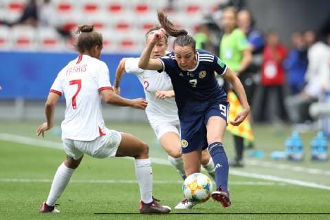 Caroline Weir of Scotland pokes the ball past Nikita Parris of England as Lucy Bronze of England looks on during the FIFA Women s World Cup match at Allianz Riviera Stadium, Nice. Picture date: 9th June 2019. Picture credit should read: Jonathan Moscrop Sportimage EDITORIAL USE ONLY. No use with unauthorised audio, video, data, fixture lists, club league logos or live services. Online in-match use limited to 120 images, no video emulation. No use in betting, games or single club league player publications. SPI-0094-0041