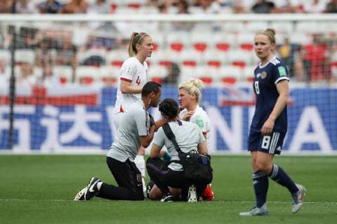 Millie Bright of England receives treatment for an injury during the FIFA Women s World Cup match at Allianz Riviera Stadium, Nice. Picture date: 9th June 2019. Picture credit should read: Jonathan Moscrop Sportimage EDITORIAL USE ONLY. No use with unauthorised audio, video, data, fixture lists, club league logos or live services. Online in-match use limited to 120 images, no video emulation. No use in betting, games or single club league player publications. SPI-0094-0056