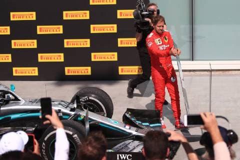 9th June 2019, Circuit Gilles Villeneuve, Montreal, Quebec, Canada; Formula 1 Grand Prix of Canada, Race day; Scuderia Ferrari, Sebastian Vettel unhappy with his penalty changes the second place board to be in front of Lewis Hamiltons car  ActionPlus12142884 Octane