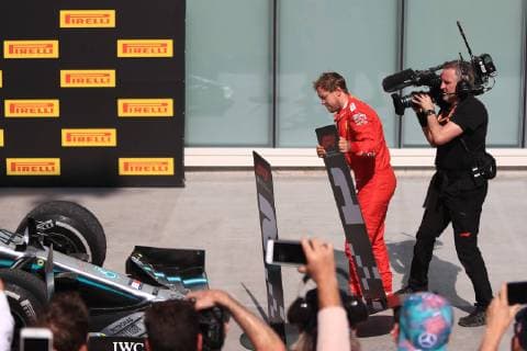 9th June 2019, Circuit Gilles Villeneuve, Montreal, Quebec, Canada; Formula 1 Grand Prix of Canada, Race day; Scuderia Ferrari, Sebastian Vettel unhappy with his penalty changes the second place board to be in front of Lewis Hamiltons car  ActionPlus12142885 Octane