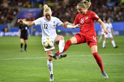 (190616) -- GRENOBLE, June 16, 2019 (Xinhua) -- Janine Beckie (R) of Canada vies with Betsy Hassett of New Zealand during the group E match between Canada and New Zealand at the 2019 FIFA Women s World Cup in Grenoble, France on June 15, 2019. Canada won 2-0. (Xinhua Chen Yichen) (SP)FRANCE-GRENOBLE-2019 FIFA WOMEN S WORLD CUP-GROUP E-CANADA VS NEW ZEALAND 