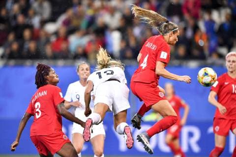 (190616) -- GRENOBLE, June 16, 2019 (Xinhua) -- Shelina Zadorsky (R, top) of Canada competes during the group E match between Canada and New Zealand at the 2019 FIFA Women s World Cup in Grenoble, France on June 15, 2019. Canada won 2-0. (Xinhua Chen Yichen) (SP)FRANCE-GRENOBLE-2019 FIFA WOMEN S WORLD CUP-GROUP E-CANADA VS NEW ZEALAND 