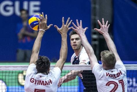 (190616) -- URMIA, June 16, 2019 -- Eskander Sliwka (top C) of Poland spikes the ball during the FIVB Volleyball Nations League match between Canada and Poland in Urmia, Iran, June 16, 2019. Poland won 3-1. ) (SP)IRAN-URMIA-FIVB VOLLEYBALL LEAGUE-POLAND VS CANADA AhmadxHalabisaz 