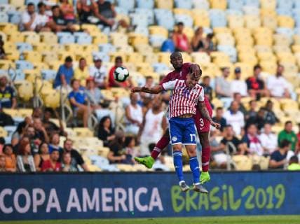 (190617) -- RIO DE JANEIRO, June 17, 2019 (Xinhua) -- Paraguay s Hernan Perez (Front) vies with Abdelkarim Fadlalla of Qatar during the Group B match between Qatar and Paraguay at the Copa America 2019, held in Rio de Janeiro, Brazil, June 16, 2019. The match ended with 2-2. (Xinhua Xin Yuewei) (SP)BRAZIL-RIO DE JANEIRO-SOCCER-COPA AMERICA 2019-QATAR VS PARAGUAY 