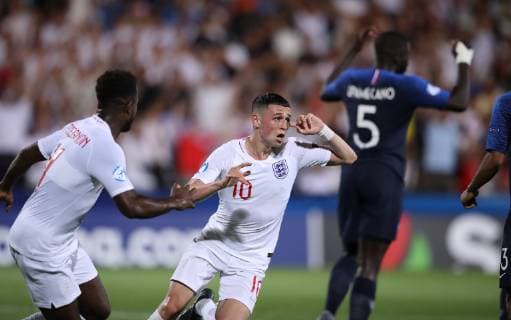 Phil Foden of England celebrates scoring the fires goal during the UEFA Under-21 Championship 2019 match at Dino Manuzzi, Cesena. Picture date: 18th June 2019. Picture credit should read: Jonathan Moscrop Sportimage EDITORIAL USE ONLY. No use with unauthorised audio, video, data, fixture lists, club league logos or live services. Online in-match use limited to 120 images, no video emulation. No use in betting, games or single club league player publications. SPI-0101-0023
