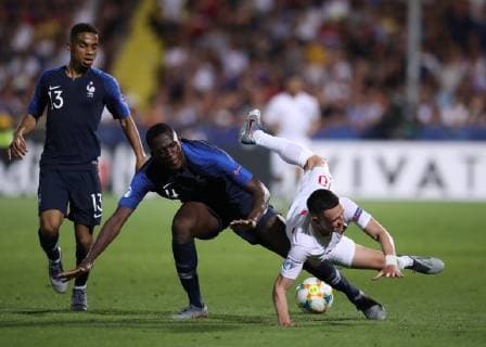 Ibrahima Konate of France brings down Phil Foden of England during the UEFA Under-21 Championship 2019 match at Dino Manuzzi, Cesena. Picture date: 18th June 2019. Picture credit should read: Jonathan Moscrop Sportimage EDITORIAL USE ONLY. No use with unauthorised audio, video, data, fixture lists, club league logos or live services. Online in-match use limited to 120 images, no video emulation. No use in betting, games or single club league player publications. SPI-0101-0034