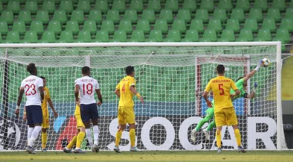 Demari Gray of England clips the shot into the top corner past a diving Ionut Radu of Romania during the UEFA Under-21 Championship 2019 match at San Marino Stadium, Serravalle. Picture date: 21st June 2019. Picture credit should read: Jonathan Moscrop Sportimage EDITORIAL USE ONLY. No use with unauthorised audio, video, data, fixture lists, club league logos or live services. Online in-match use limited to 120 images, no video emulation. No use in betting, games or single club league player publications. SPI-0103-0024