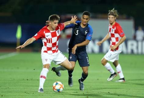 June 21, 2019 - Serravalle, Italy - Luka Ivanusec of Croatia and Colin Dagba of France during the UEFA Under 21 Championship Group C match France v Croatia at the San Marino Olimpic Stadium in Serravalle, Italy on June 21, 2019. France v Croatia - UEFA U-21 Championship  - ZUMAn230 20190621_zaa_n230_655 Copyright: xMatteoxCiambellix