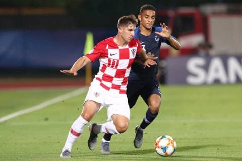 Luka Ivanusec of Croatia and Colin Dagba of France compete for the ball Serravalle 21-06-2019 Stadio San Marino Stadium Football UEFA Under 21 Championship Italy 2019 Group Stage - Final Tournament Group C France - Croatia Photo Cesare Purini Insidefoto CesarexPurini