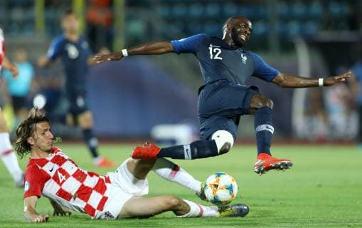 June 21, 2019 - Serravalle, Italy - Ivan Sunjic of Croatia tackles on Jonathan Ikone of France during the UEFA Under 21 Championship Group C match France v Croatia at the San Marino Olimpic Stadium in Serravalle, Italy on June 21, 2019. France v Croatia - UEFA U-21 Championship  - ZUMAn230 20190621_zaa_n230_665 Copyright: xMatteoxCiambellix