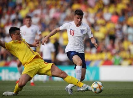 Alexandru Pascanu of Romania tackles Mason Mount of England during the UEFA Under-21 Championship 2019 match at Stadio Dino Manuzzi, Cesena. Picture date: 21st June 2019. Picture credit should read: Jonathan Moscrop Sportimage EDITORIAL USE ONLY. No use with unauthorised audio, video, data, fixture lists, club league logos or live services. Online in-match use limited to 120 images, no video emulation. No use in betting, games or single club league player publications. SPI-0103-0009